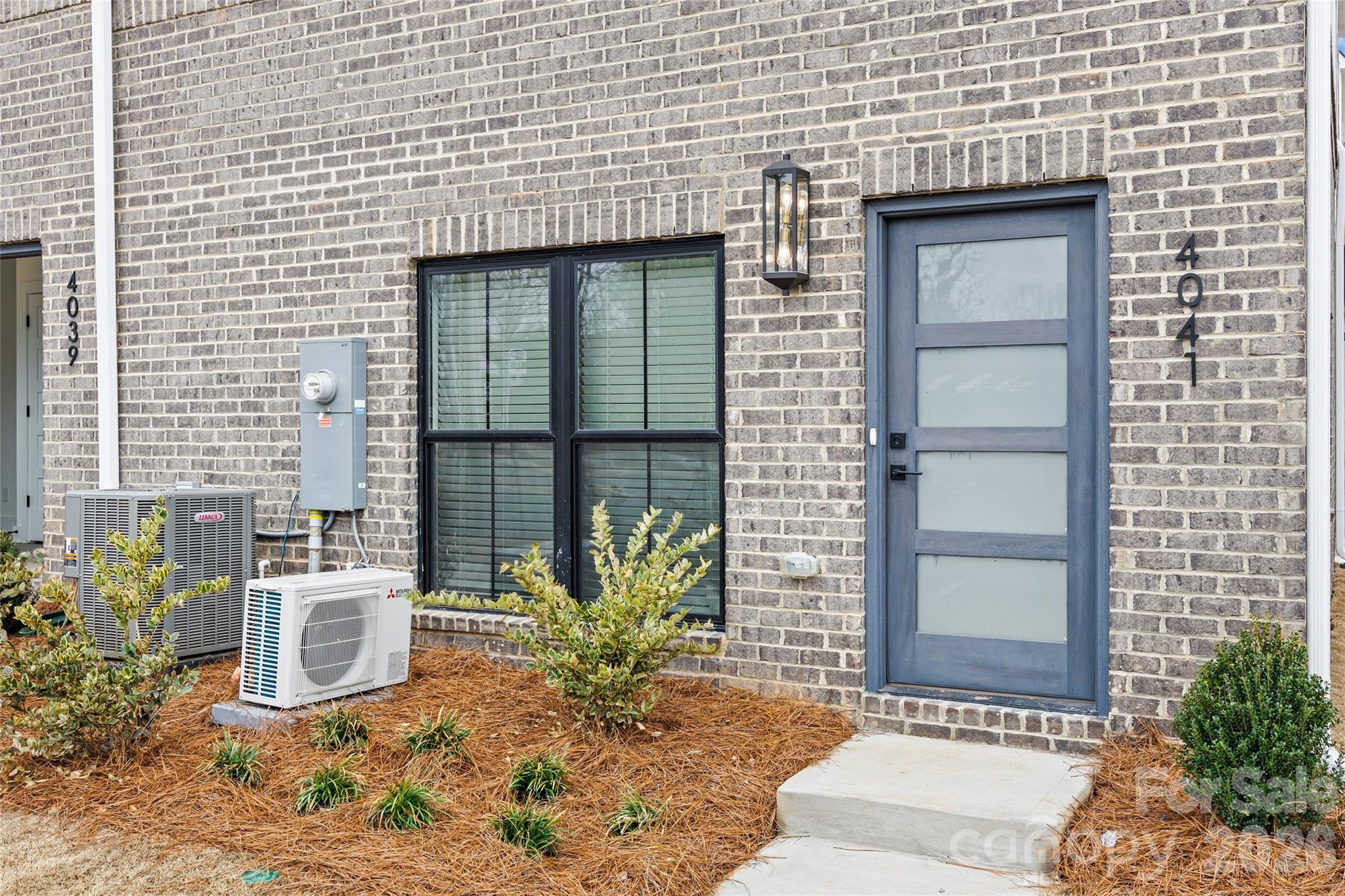 4041 South Tryon Street Charlotte, NC 28217 - Photo 6 of 45 a front view of a house with a yard