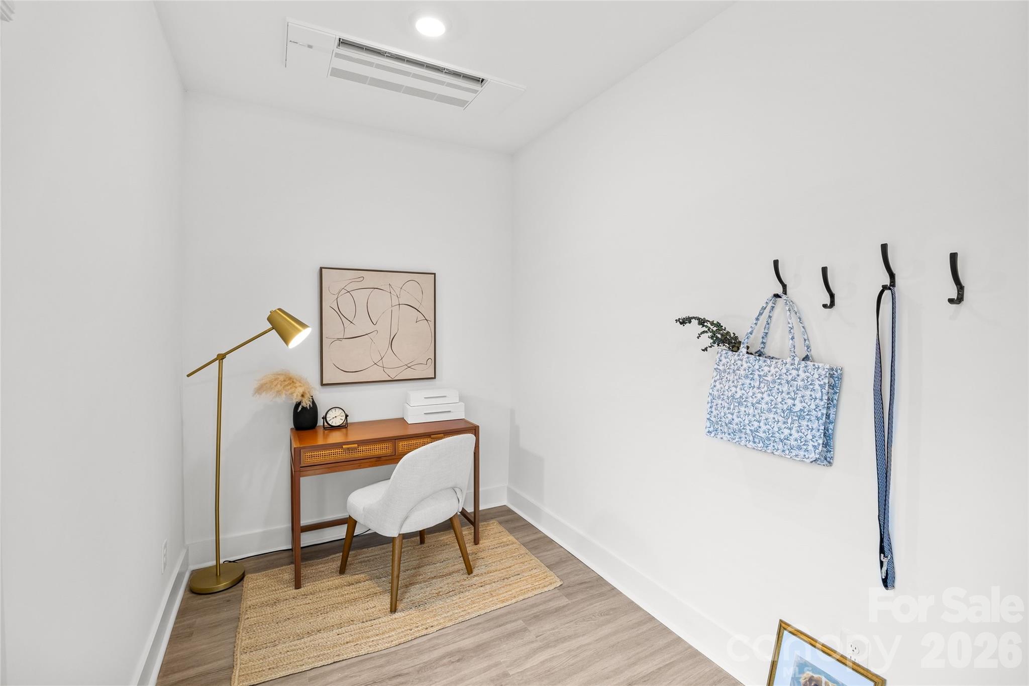4041 South Tryon Street Charlotte, NC 28217 - Photo 9 of 45 a bedroom with a bed and a chair