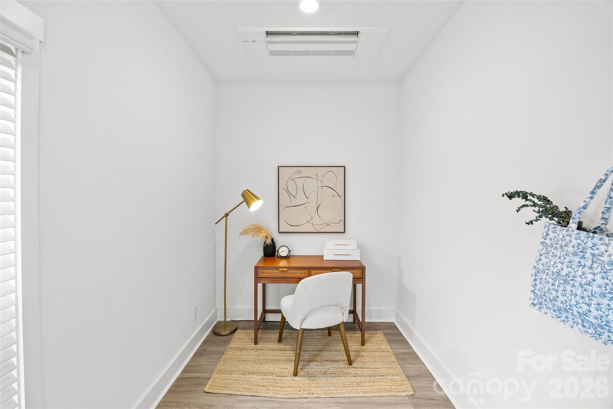 4041 South Tryon Street Charlotte, NC 28217 - Photo 10 of 45 a bedroom with a bed and chair