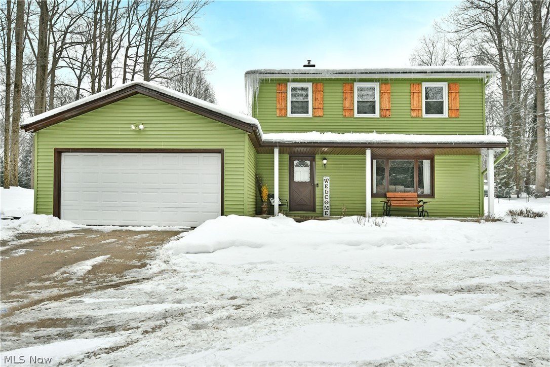 4251 Wayne Road Mantua, OH 44255 - Photo 1 of 34 Traditional-style home with a garage and a porch