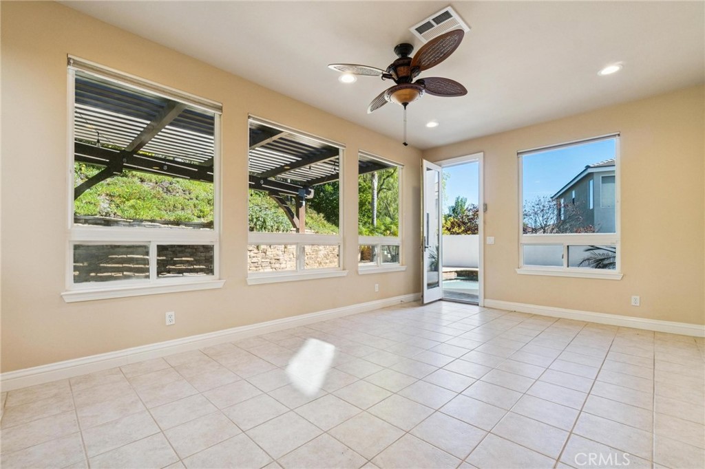 26511 Brooks Circle Stevenson Ranch, CA 91381 - Photo 20 of 65 a view of an empty room with a window and kitchen view