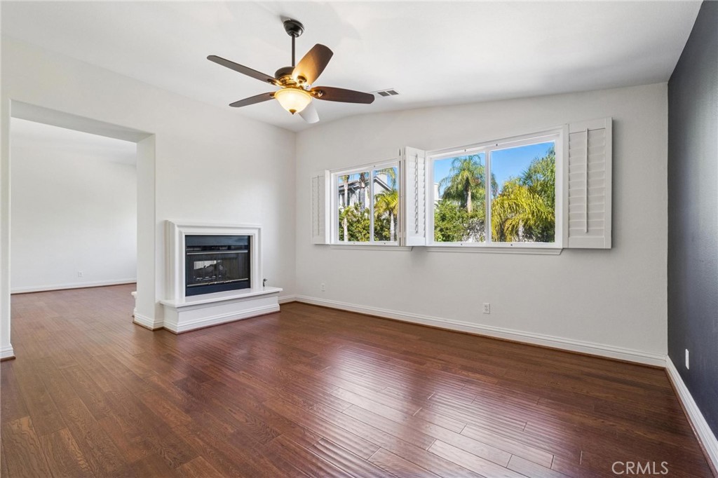 26511 Brooks Circle Stevenson Ranch, CA 91381 - Photo 26 of 65 a view of an empty room with wooden floor and a window