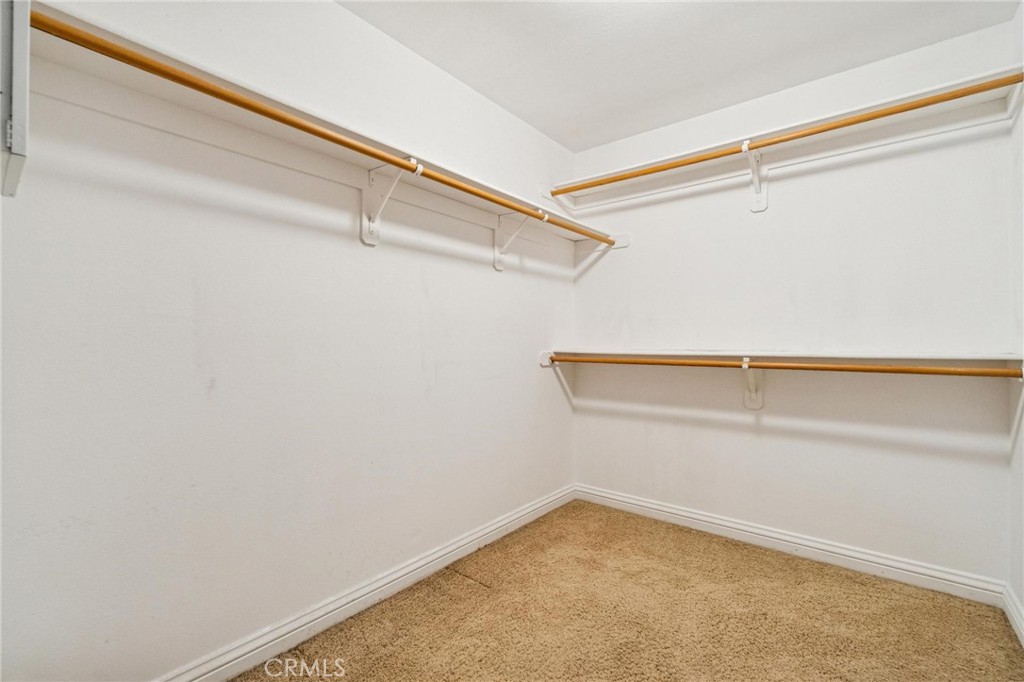 26511 Brooks Circle Stevenson Ranch, CA 91381 - Photo 31 of 65 a view of a room with racks on the wall