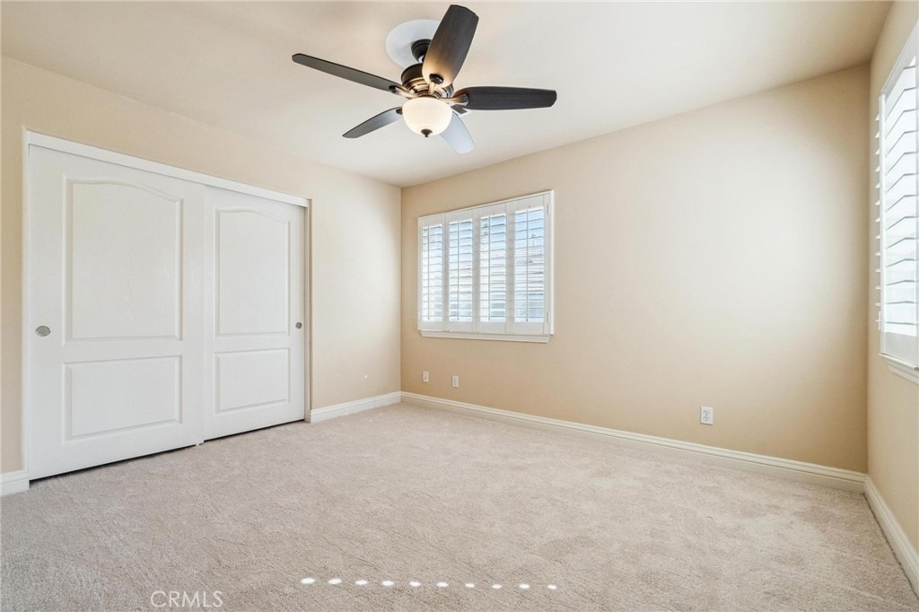 26511 Brooks Circle Stevenson Ranch, CA 91381 - Photo 32 of 65 an empty room with windows and fan