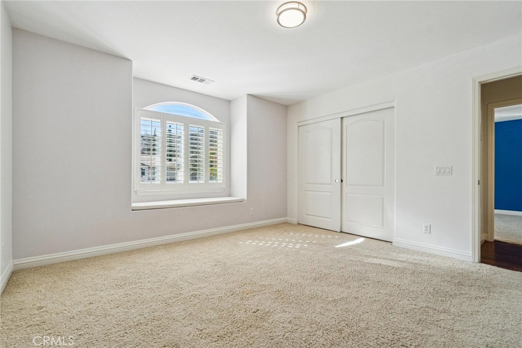 26511 Brooks Circle Stevenson Ranch, CA 91381 - Photo 37 of 65 an empty room with windows