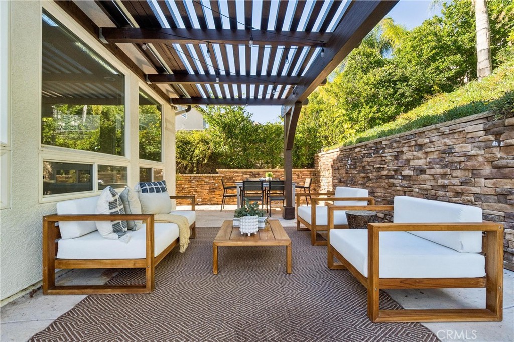 26511 Brooks Circle Stevenson Ranch, CA 91381 - Photo 42 of 65 a outdoor living space with patio furniture and a potted plant