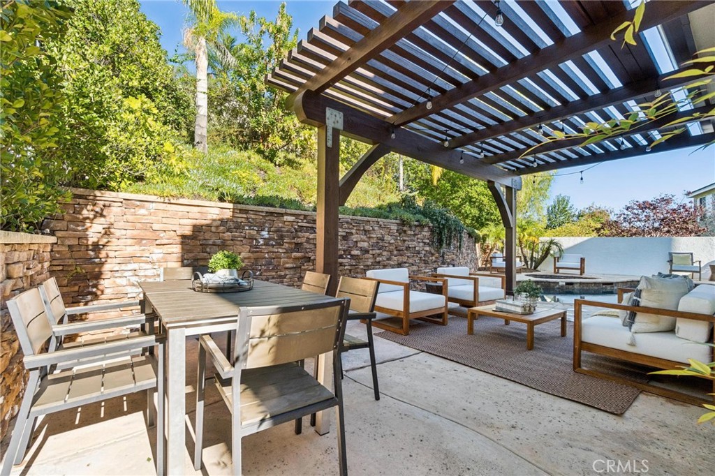 26511 Brooks Circle Stevenson Ranch, CA 91381 - Photo 45 of 65 a patio with glass top table and chairs