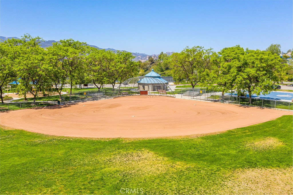 26511 Brooks Circle Stevenson Ranch, CA 91381 - Photo 64 of 65 a view of a yard with a house in the background