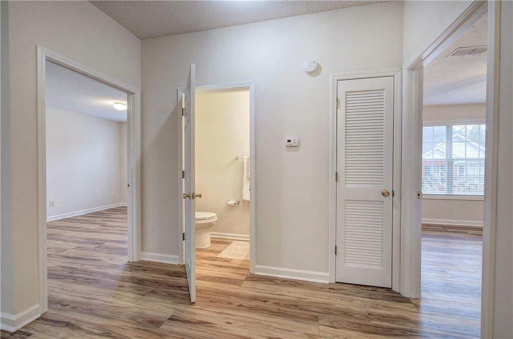 150 Old Mill Road, Unit 205 Cartersville, GA 30120 - Photo 16 of 32 a view of a hallway with wooden floor