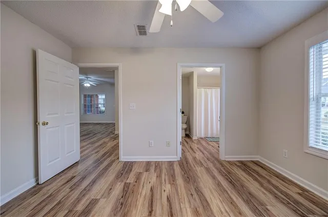 a view of a bathroom with a toilet and a shower