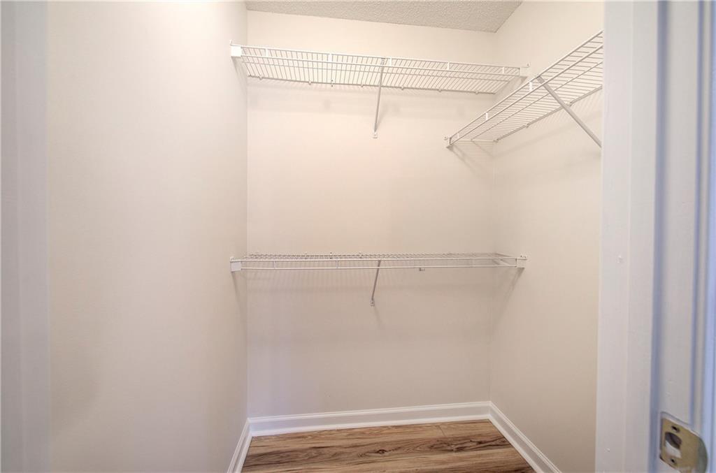 150 Old Mill Road, Unit 205 Cartersville, GA 30120 - Photo 22 of 32 a view of a room with racks on the wall