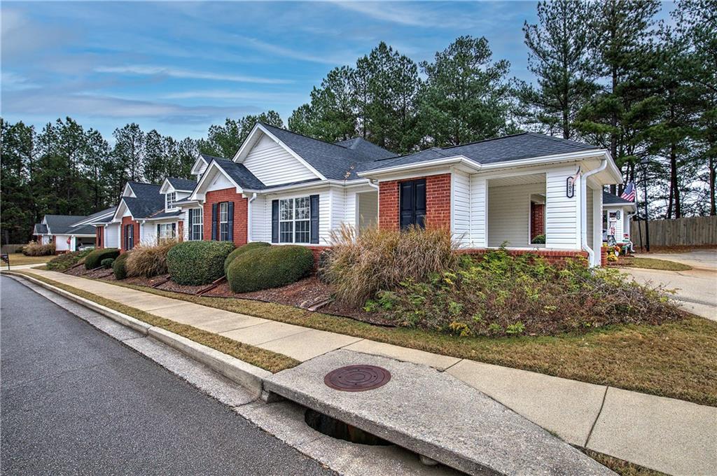 150 Old Mill Road, Unit 205 Cartersville, GA 30120 - Photo 29 of 32 a front view of a house with trees