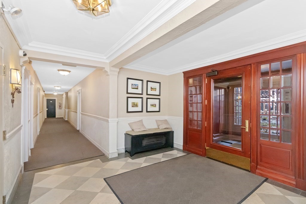 62 Queensberry Street, Unit 407 Boston, MA 02215 - Photo 11 of 14 a view of a hallway with an entryway and fire place