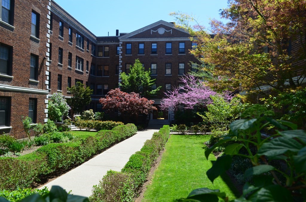 62 Queensberry Street, Unit 407 Boston, MA 02215 - Photo 14 of 14 a view of a large brick building next to a yard