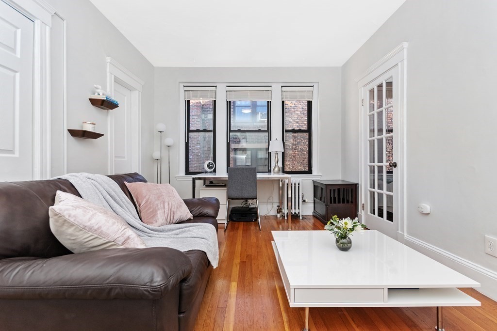 62 Queensberry Street, Unit 407 Boston, MA 02215 - Photo 2 of 14 a living room with furniture window and wooden floor