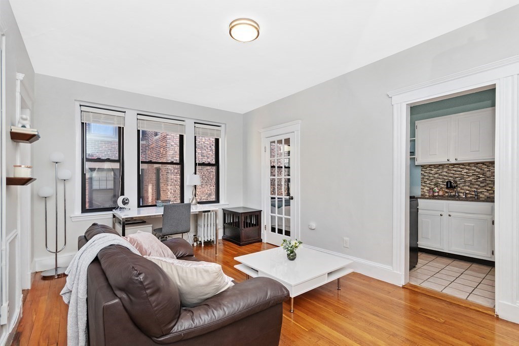 62 Queensberry Street, Unit 407 Boston, MA 02215 - Photo 3 of 14 a living room with furniture and entry gate