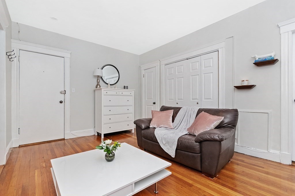 62 Queensberry Street, Unit 407 Boston, MA 02215 - Photo 4 of 14 a living room with furniture and wooden floor