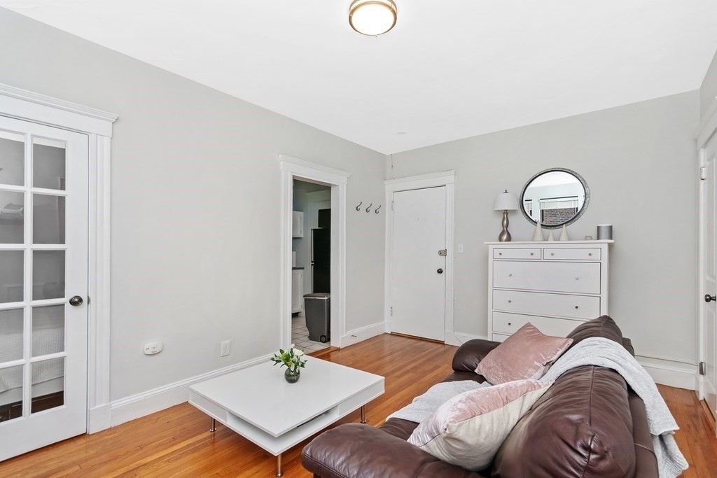62 Queensberry Street, Unit 407 Boston, MA 02215 - Photo 5 of 14 a bedroom with a bed and wooden floor