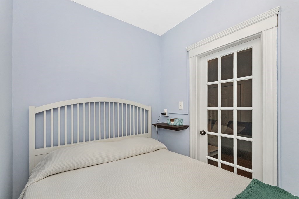 62 Queensberry Street, Unit 407 Boston, MA 02215 - Photo 8 of 14 a bed room with a bed and a window