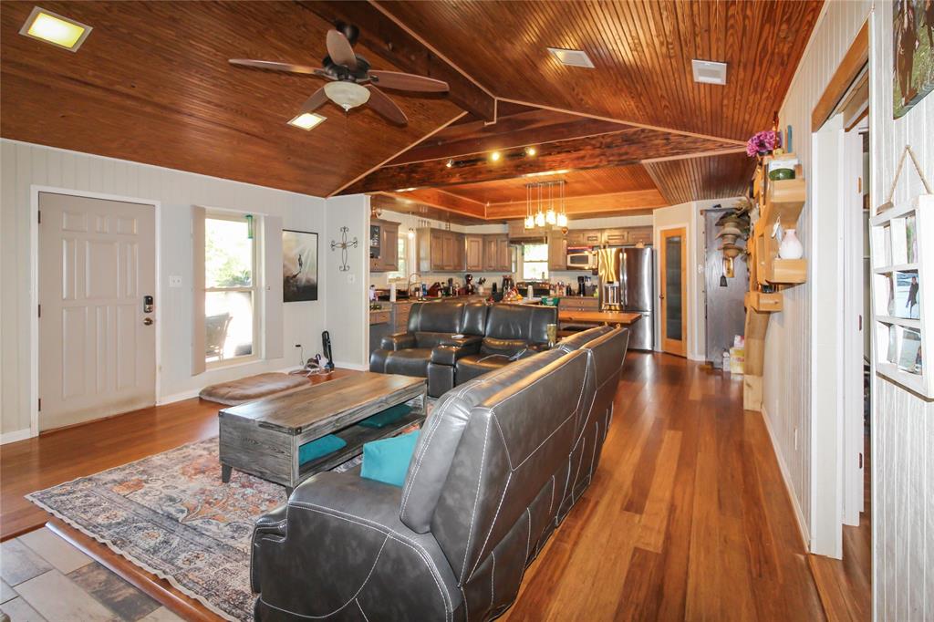 1001 Sandy Ridge Road Scurry, TX 75158 - Photo 14 of 35 Vaulted wood-paneled ceiling with recessed lighting and a ceiling fan