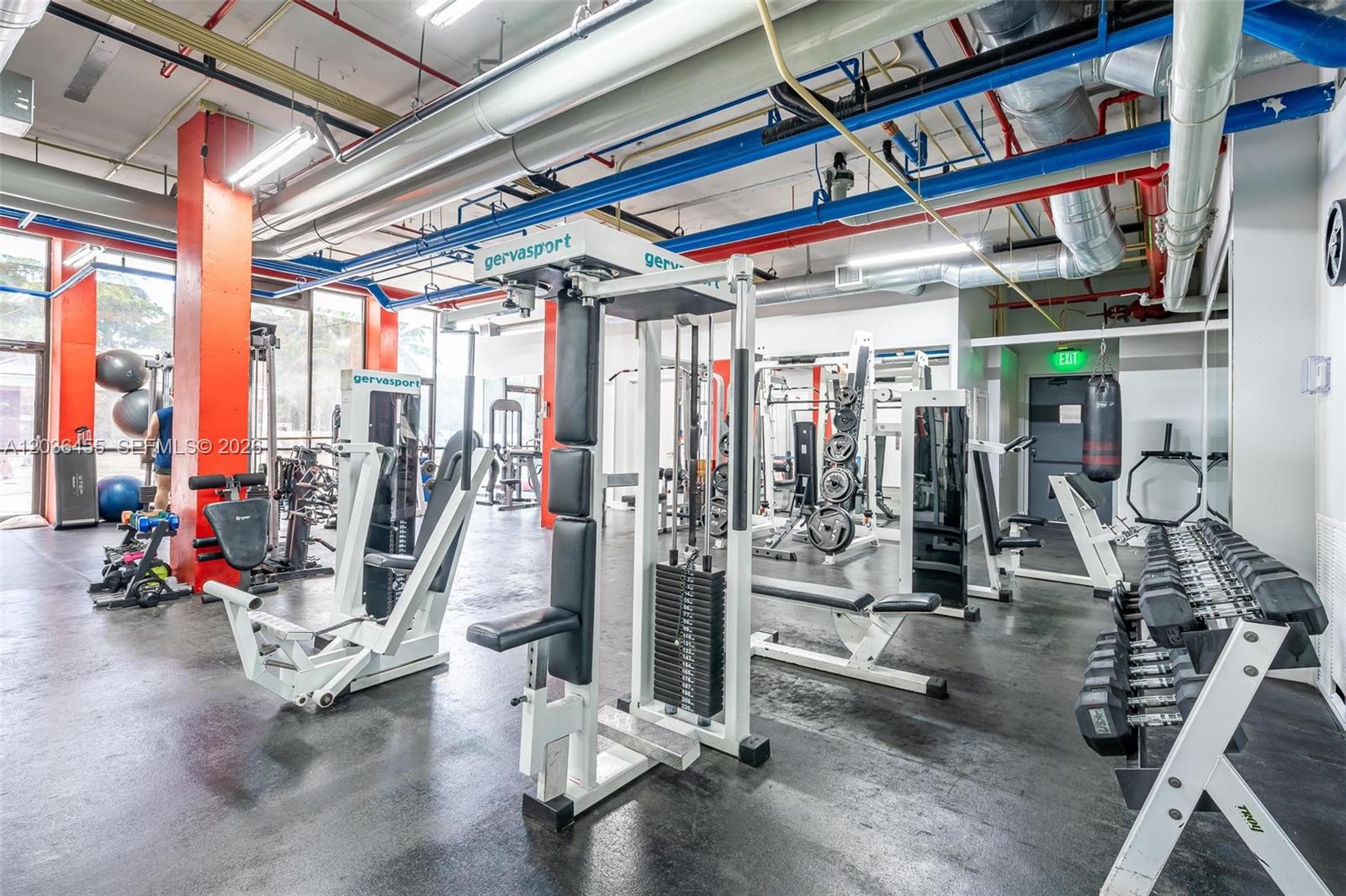 780 Northeast 69th Street, Unit 1010 Miami, FL 33138 - Photo 31 of 31 a view of a room with gym equipment