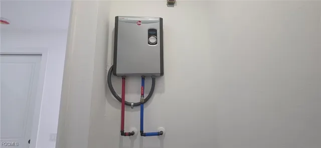 a bathroom with a granite countertop toilet and a sink