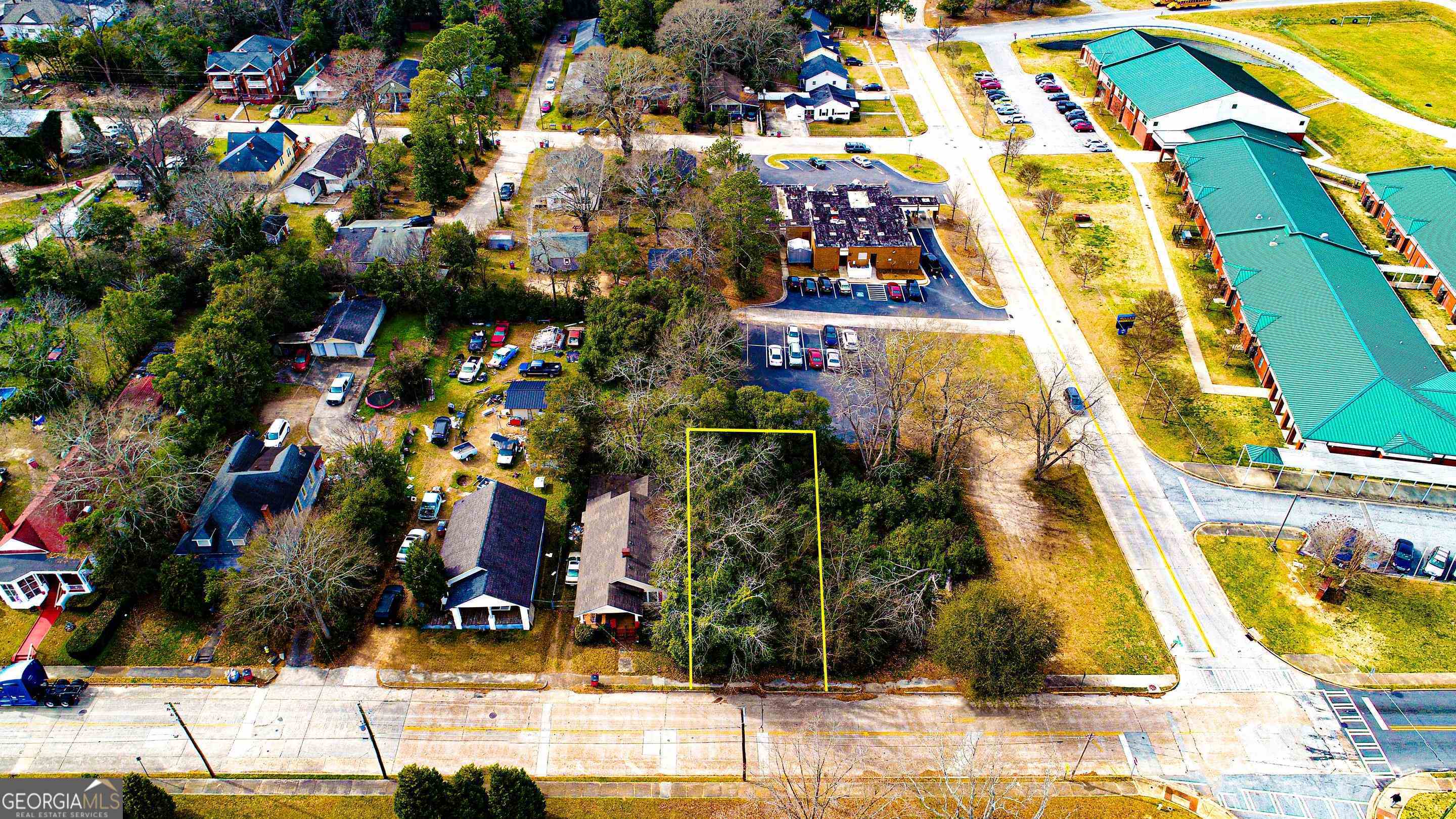 a view of multiple houses with yard