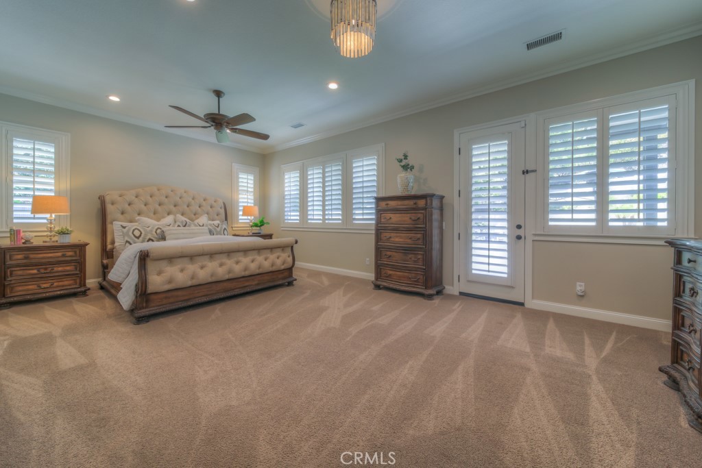 30370 Vía El Delora Temecula, CA 92592 - Photo 17 of 75 a spacious bedroom with a bed and a window