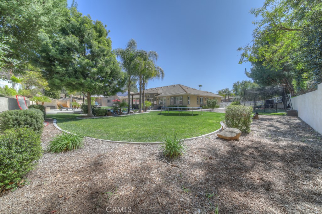 30370 Vía El Delora Temecula, CA 92592 - Photo 54 of 75 a view of a garden with a slide