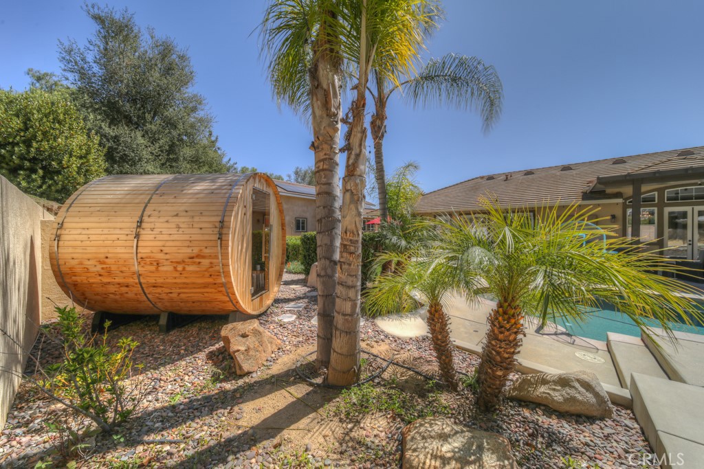 30370 Vía El Delora Temecula, CA 92592 - Photo 58 of 75 a view of a garden with wooden fence