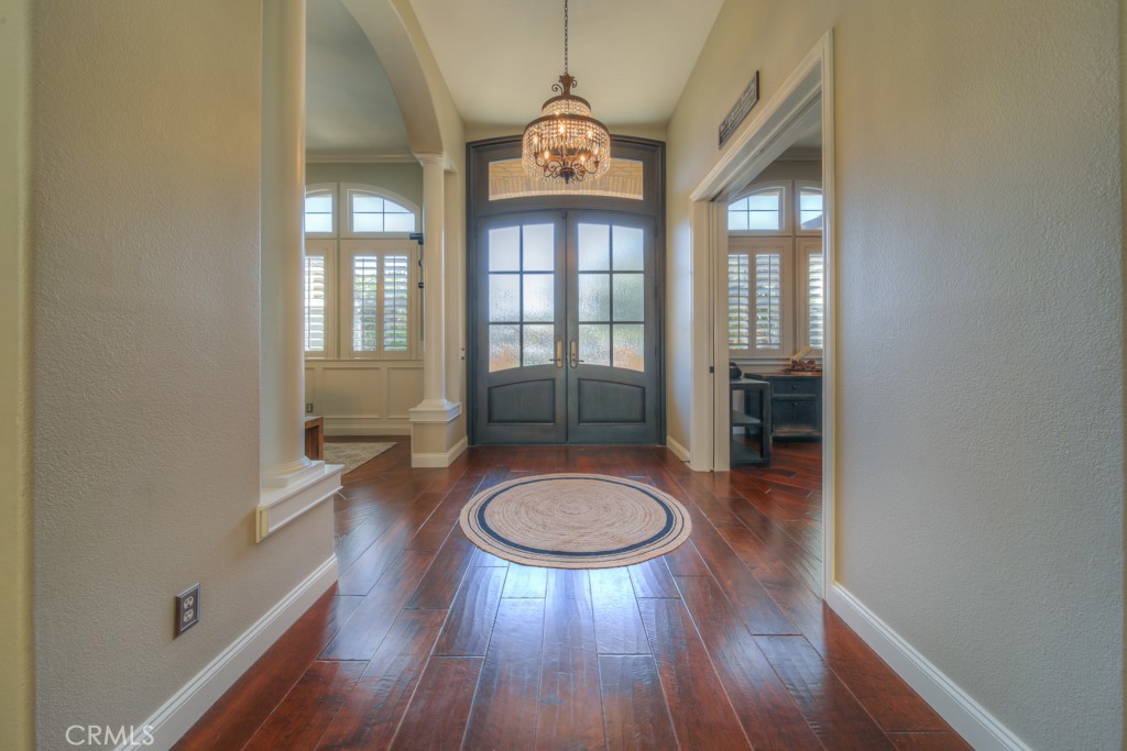 30370 Vía El Delora Temecula, CA 92592 - Photo 8 of 75 a room with wooden floor and a view of bathroom