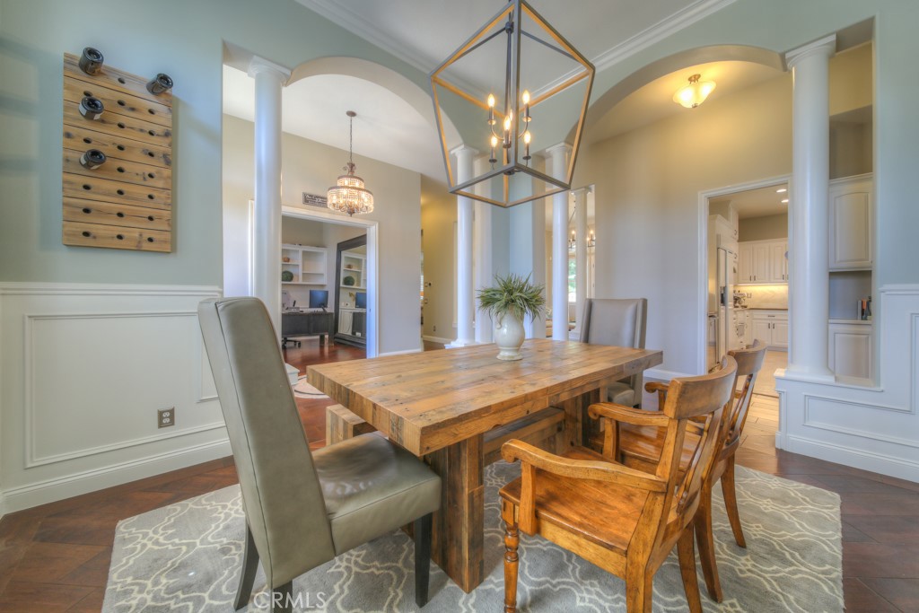 30370 Vía El Delora Temecula, CA 92592 - Photo 9 of 75 a view of a dining room with furniture and a chandelier