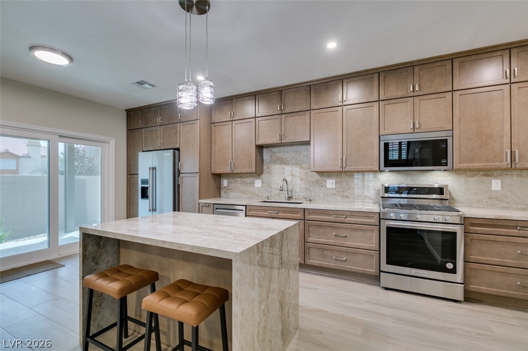 540 Sutters Mill Road Henderson, NV 89014 - Photo 28 of 46 This sleek kitchen features modern amenities and a functional layout, perfect for daily living and entertaining.