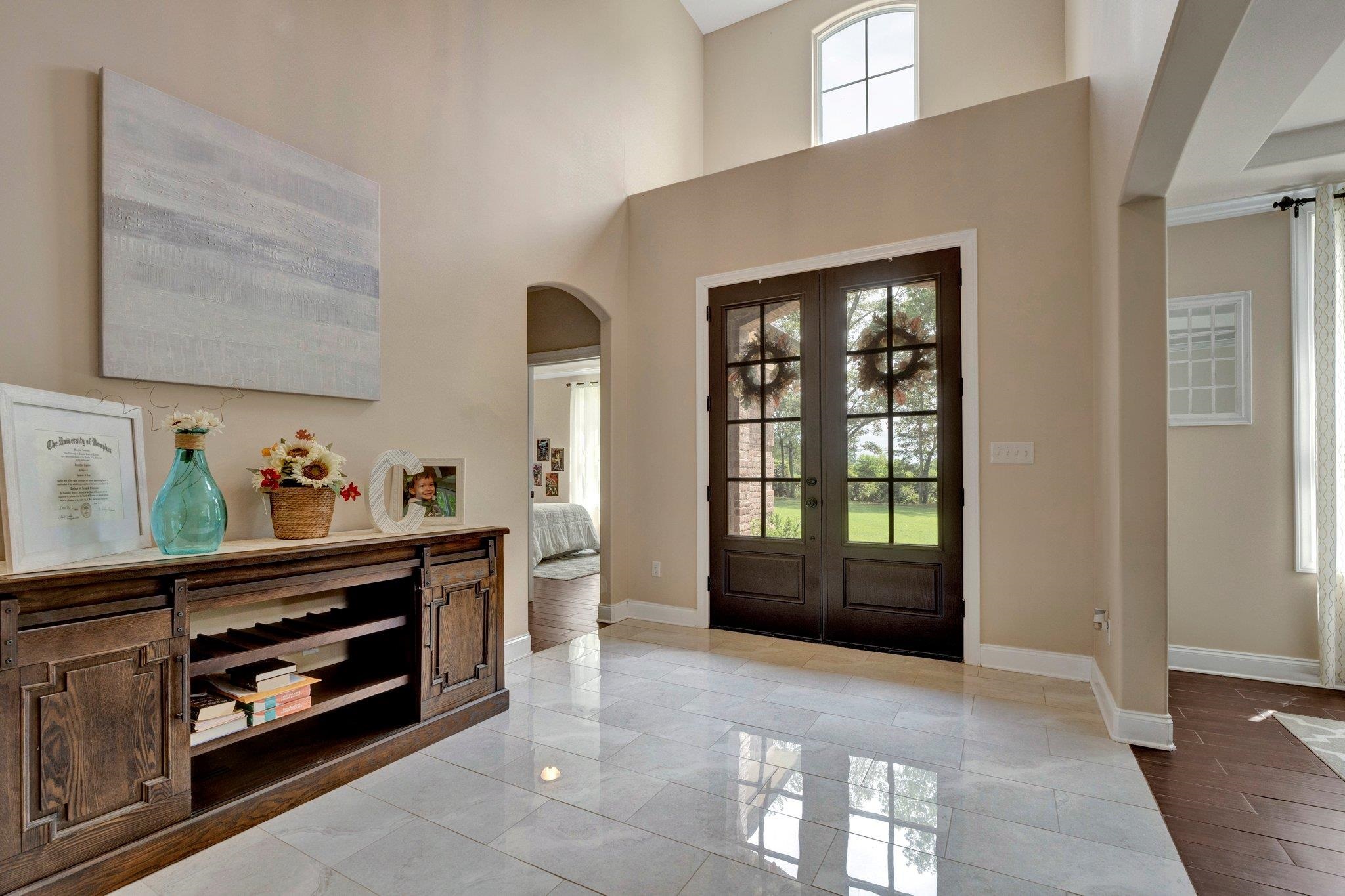 3270 Rast Road Millington, TN 38053 - Photo 19 of 40 Entrance foyer featuring arched walkways, a high ceiling, and french doors