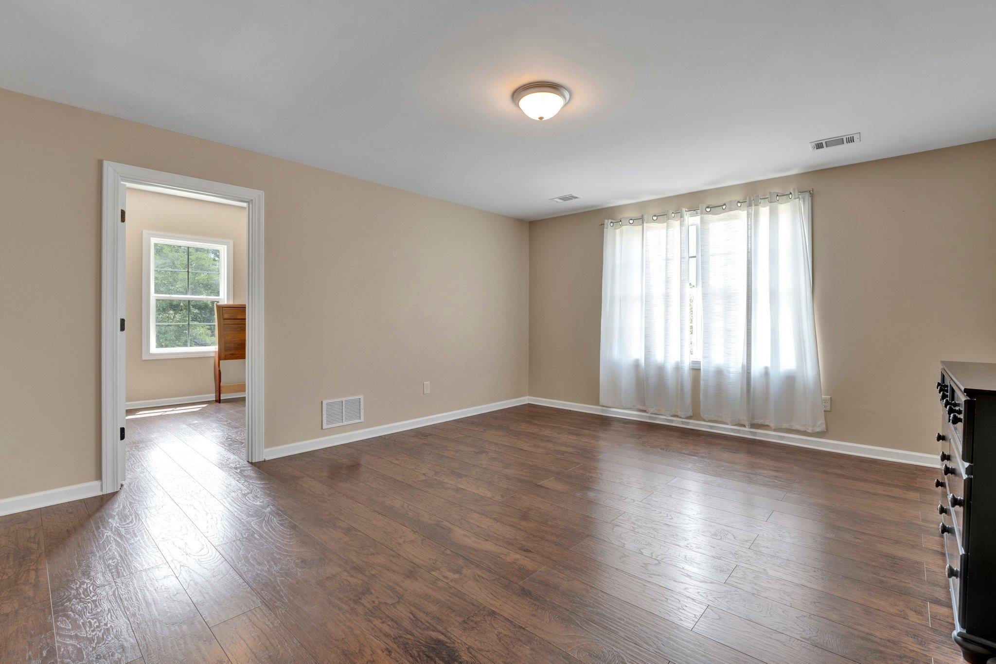 3270 Rast Road Millington, TN 38053 - Photo 34 of 40 Empty room featuring baseboards and dark wood finished floors