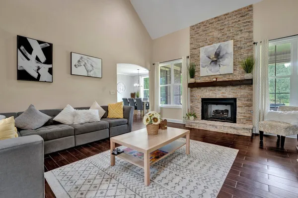 a living room with furniture and a fireplace