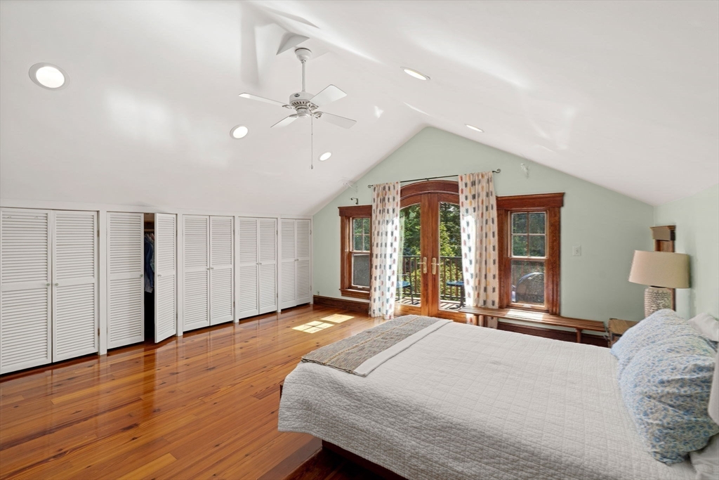 177 Highland Road Andover, MA 01810 - Photo 25 of 37 a spacious bedroom with a large bed and a chandelier