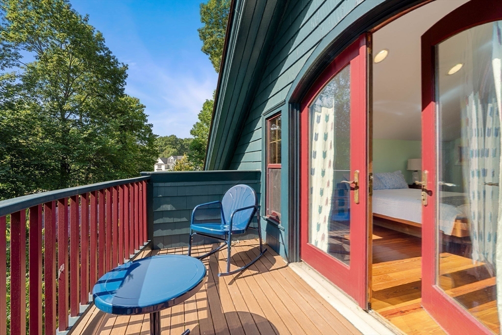 177 Highland Road Andover, MA 01810 - Photo 27 of 37 a balcony with chairs and wooden floor