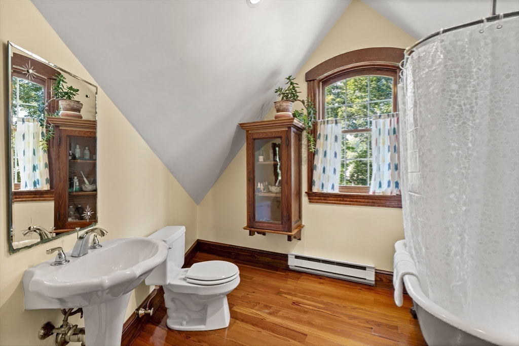 177 Highland Road Andover, MA 01810 - Photo 28 of 37 a bathroom with a toilet a sink and a window
