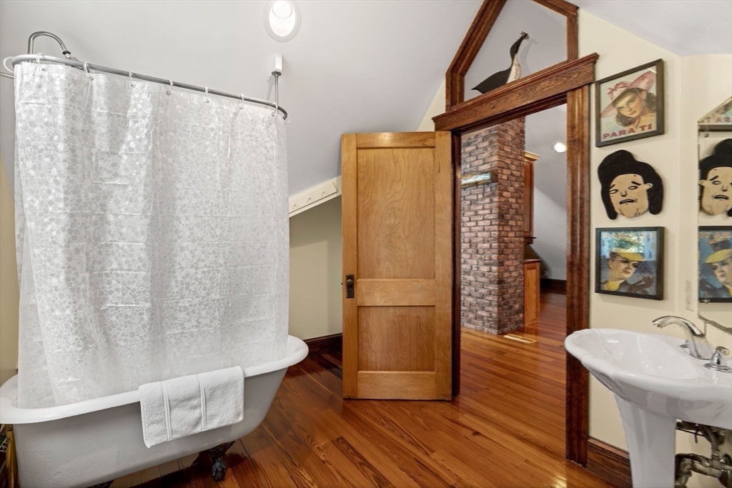 177 Highland Road Andover, MA 01810 - Photo 29 of 37 a bathroom with a sink a mirror a toilet and a shower