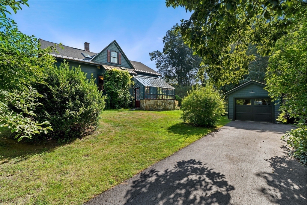 177 Highland Road Andover, MA 01810 - Photo 3 of 37 a front view of a house with garden
