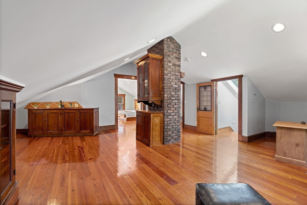 177 Highland Road Andover, MA 01810 - Photo 31 of 37 a living room with furniture and a wooden floor