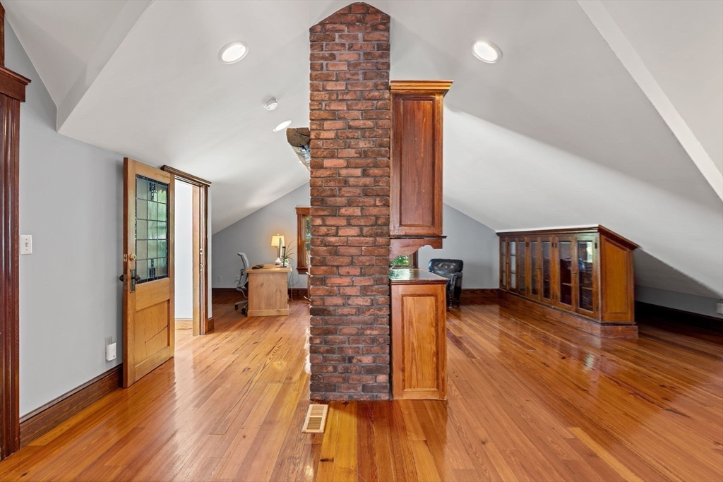 177 Highland Road Andover, MA 01810 - Photo 32 of 37 a living room with furniture and wooden floor