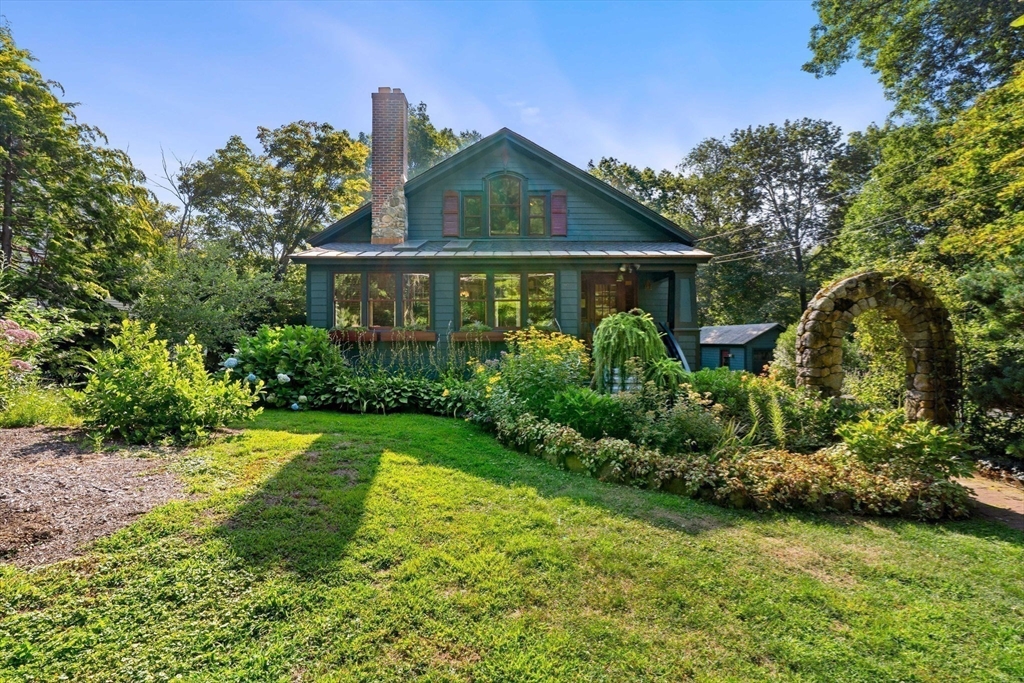 177 Highland Road Andover, MA 01810 - Photo 36 of 37 a front view of a house with garden