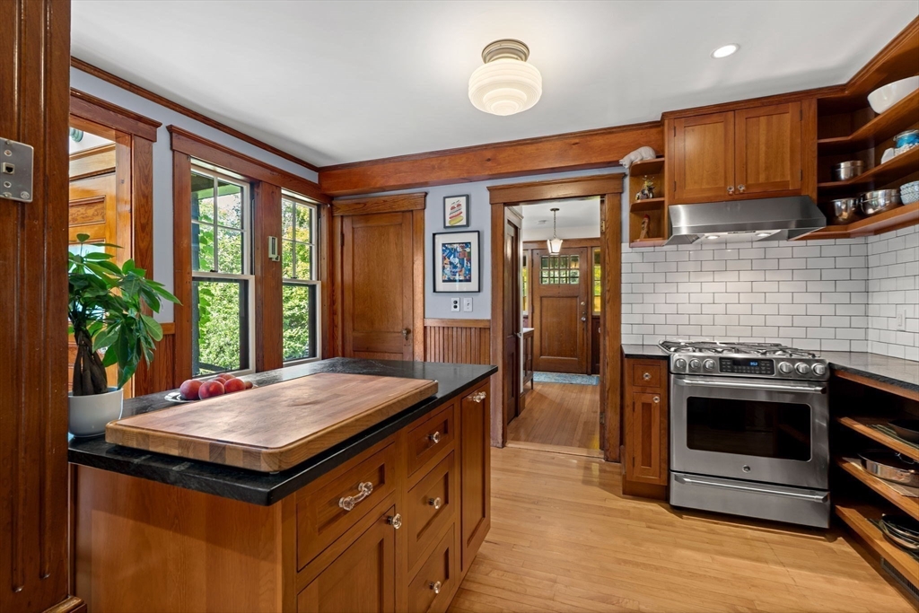 177 Highland Road Andover, MA 01810 - Photo 4 of 37 a kitchen with a stove and a wooden floor