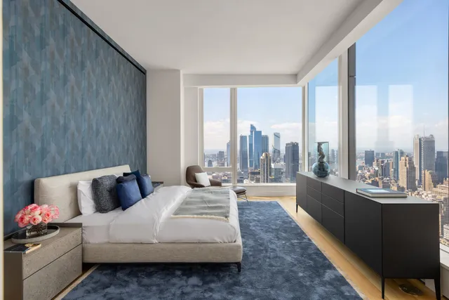 a bedroom with bed and window