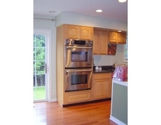 161 Rice Corner Road Brookfield, MA 01506 - Photo 13 of 28 a kitchen with a stove and a microwave