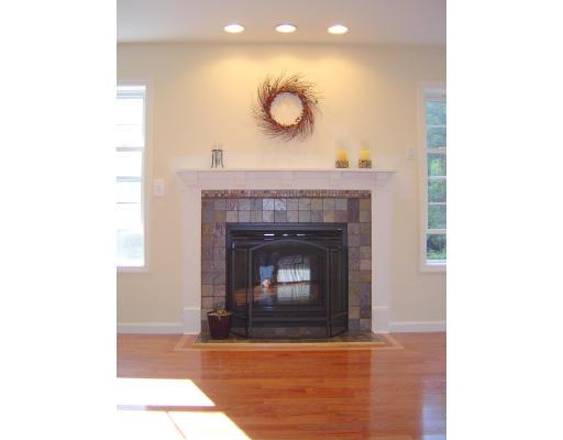 161 Rice Corner Road Brookfield, MA 01506 - Photo 16 of 28 a living room with furniture and a fireplace