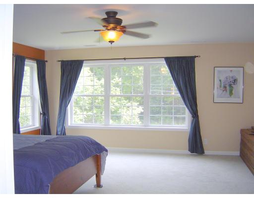 161 Rice Corner Road Brookfield, MA 01506 - Photo 19 of 28 a bedroom with a bed and a large window