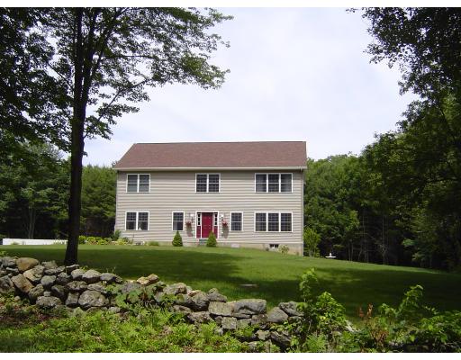 161 Rice Corner Road Brookfield, MA 01506 - Photo 2 of 28 a front view of a house with a yard